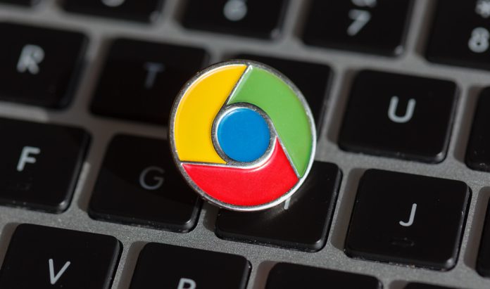 Google Chrome logo pin on a laptop keyboard