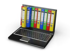 Laptop with colorful ring binders; file compression and zipping.