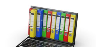Cara Untuk Kompres dan Zip Fail atau Dokumen Laptop with colorful ring binders; file compression and zipping.