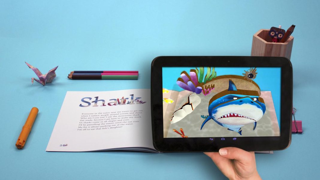 Child reading book with augmented reality shark on tablet. "Shark" title visible. Teknologi AR dalam Pendidikan.