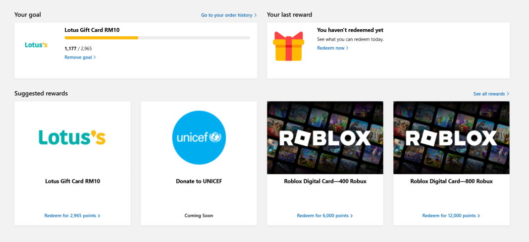 Rewards interface showing free Robux and Lotus gift cards. Earn points to redeem.