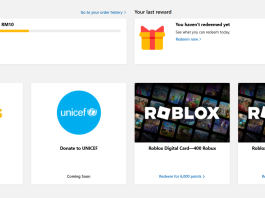 Rewards interface showing free Robux and Lotus gift cards. Earn points to redeem.